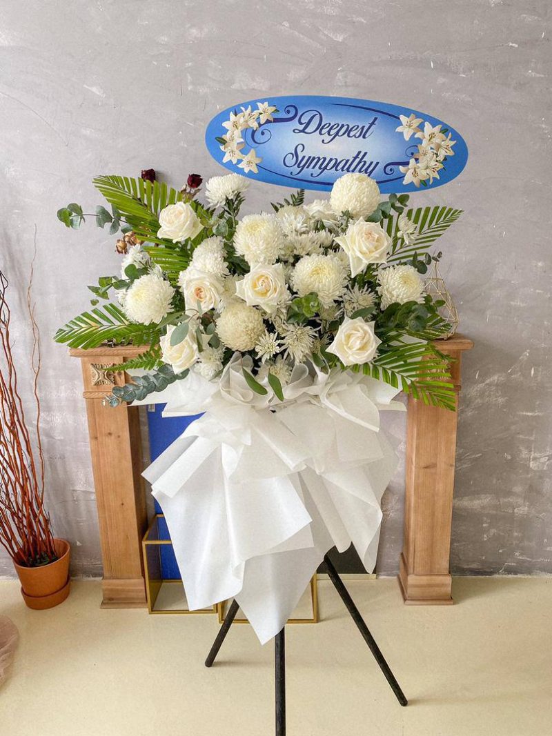 Funeral flower stand with white and pink flowers in Puchong