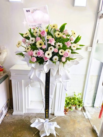 Condolence flower stand delivered by florist to PJ funeral parlour
